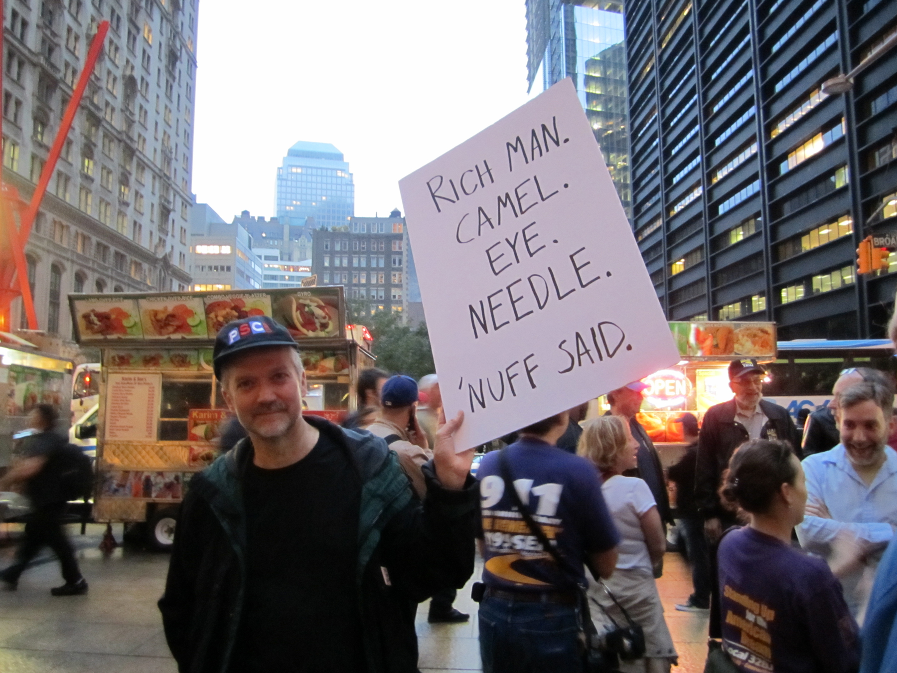 Oct 14 Rich man sign - Peter Hogness - by Amanda Magalhaes.jpg